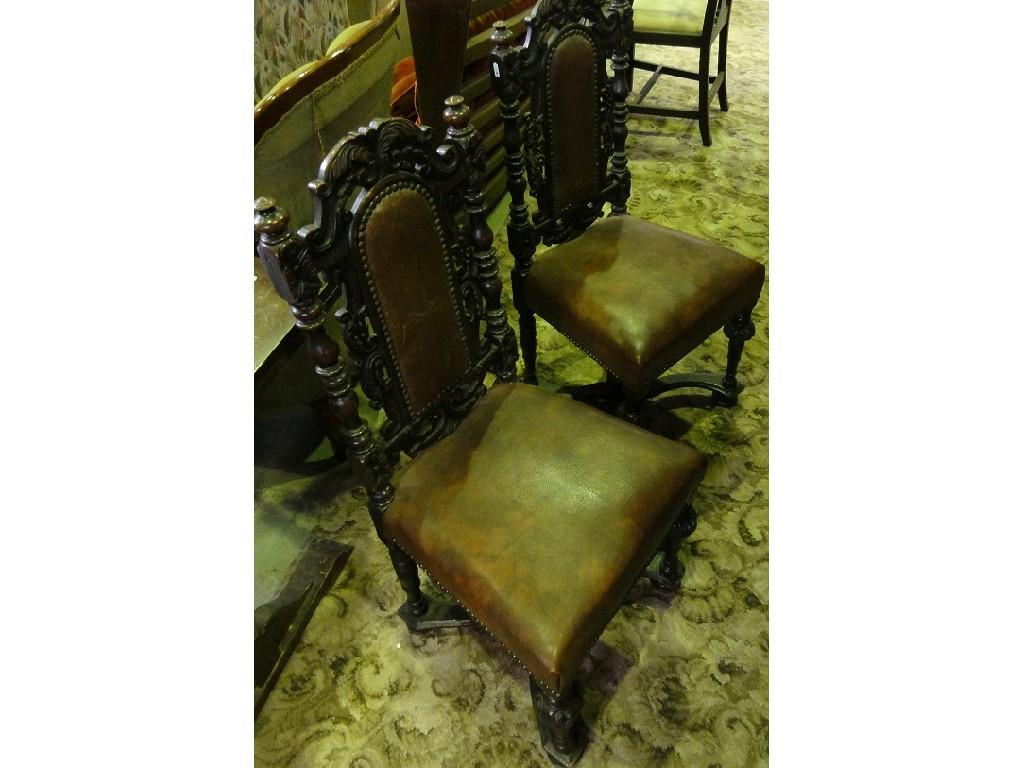 Appraisal: A pair of Victorian oak hall side chairs with leather