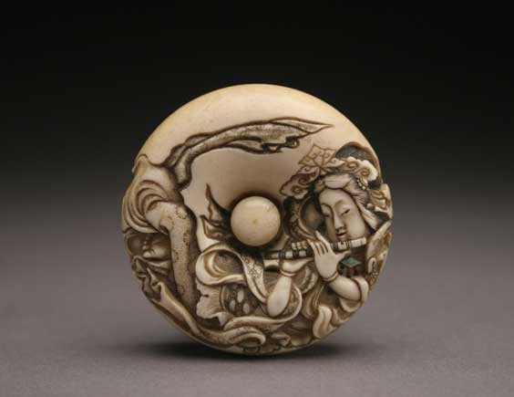 Appraisal: ANTIQUE IVORY MANJU Antique and well carved ivory manju netsuke