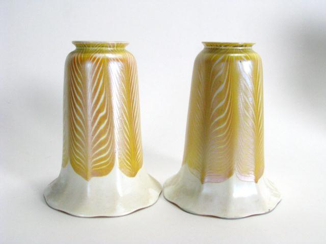 Appraisal: Pair of Quezal art glass lamp shades with feather design