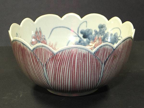 Appraisal: A underglaze blue and copper red-decorated floriform bowl Kangxi Mark