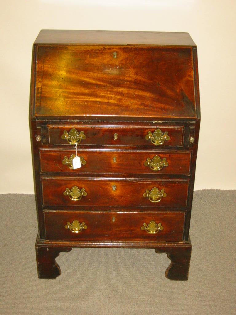 Appraisal: A GEORGE III MAHOGANY BUREAU of small proportions the fallfront