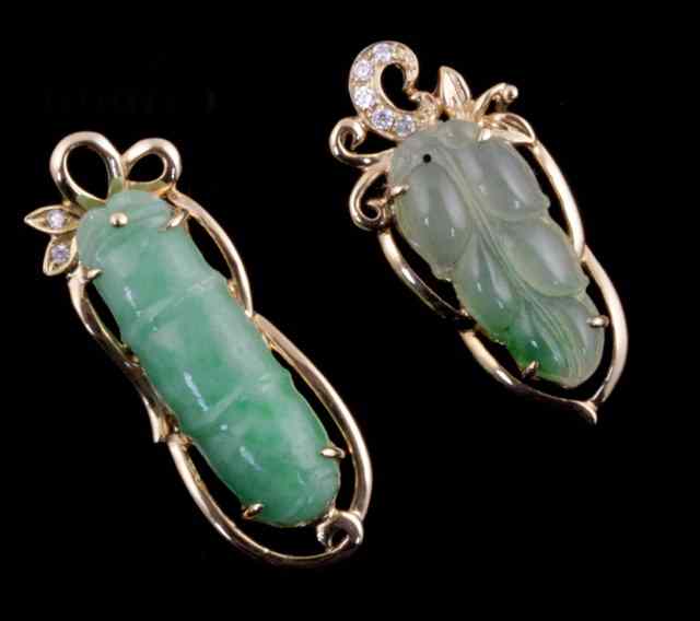 Appraisal: Two Chinese green stone and paste set pendants