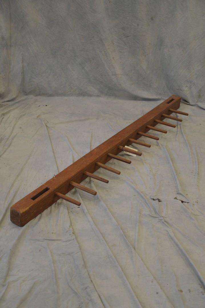 Appraisal: Primitive pine wall rack with peg hooks long x -