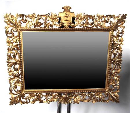 Appraisal: An Italian style gilt overmantel mirror the elaborate vine boarder