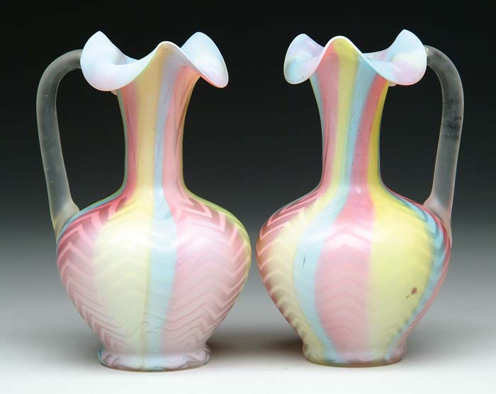 Appraisal: PAIR OF RAINBOW MOP SATIN EWERS Herringbone pattern with colors