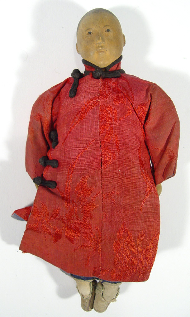 Appraisal: Oriental child's doll with carved wooden head and hands in