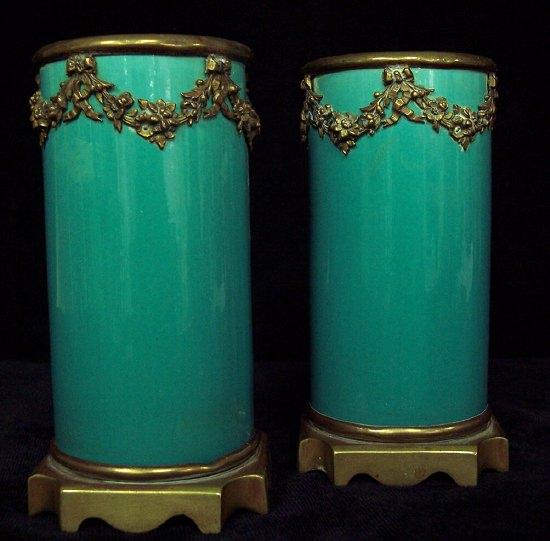 Appraisal: A pair of cylindrical vases of turquoise ground having gilt