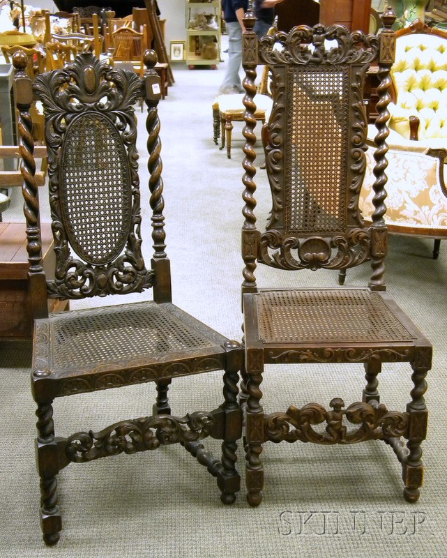 Appraisal: Two Jacobean-style Caned Carved Oak and Walnut Hall Chairs