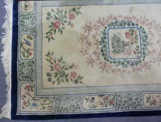 Appraisal: A Chinese wool carpet sewn with birds in panels on