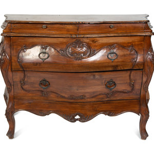 Appraisal: A French Provincial Style Carved Walnut Bombe Commode TH CENTURY