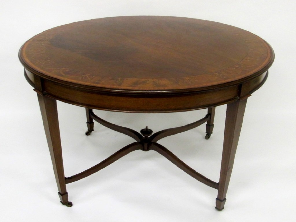 Appraisal: An Edwardian mahogany inlaid circular window table decorated with a