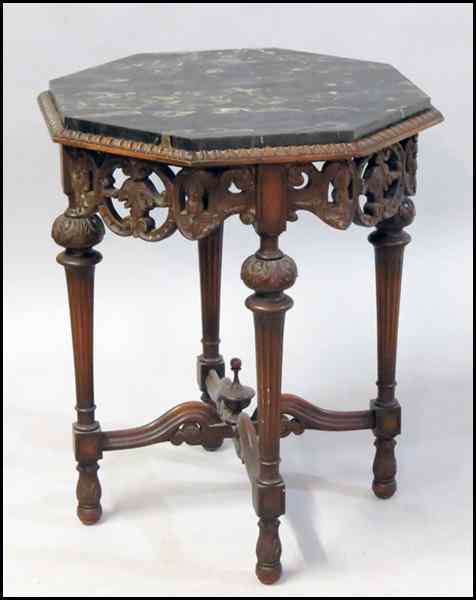 Appraisal: CARVED MAHOGANY OCTAGONAL TABLE With a marble top '' x