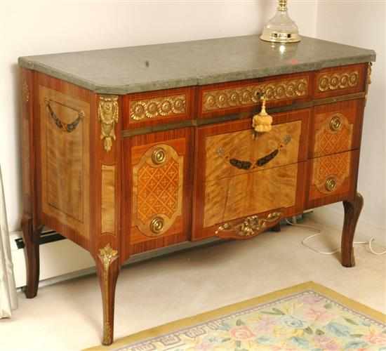 Appraisal: A Louis XVI style kingwood and marquetry commode The rectangular