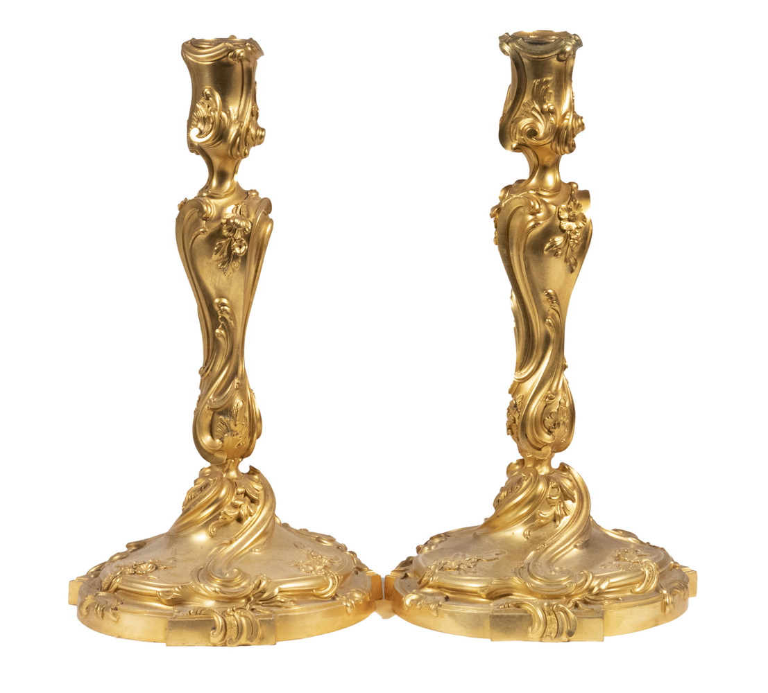 Appraisal: PR FRENCH FIRE GILDED BRONZE CANDLESTICKS Pair of Louis XV