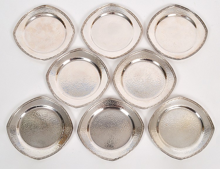 Appraisal: EIGHT AMERICAN HAND-HAMMERED SILVER PLATE BREAD PLATESFirst Half of the