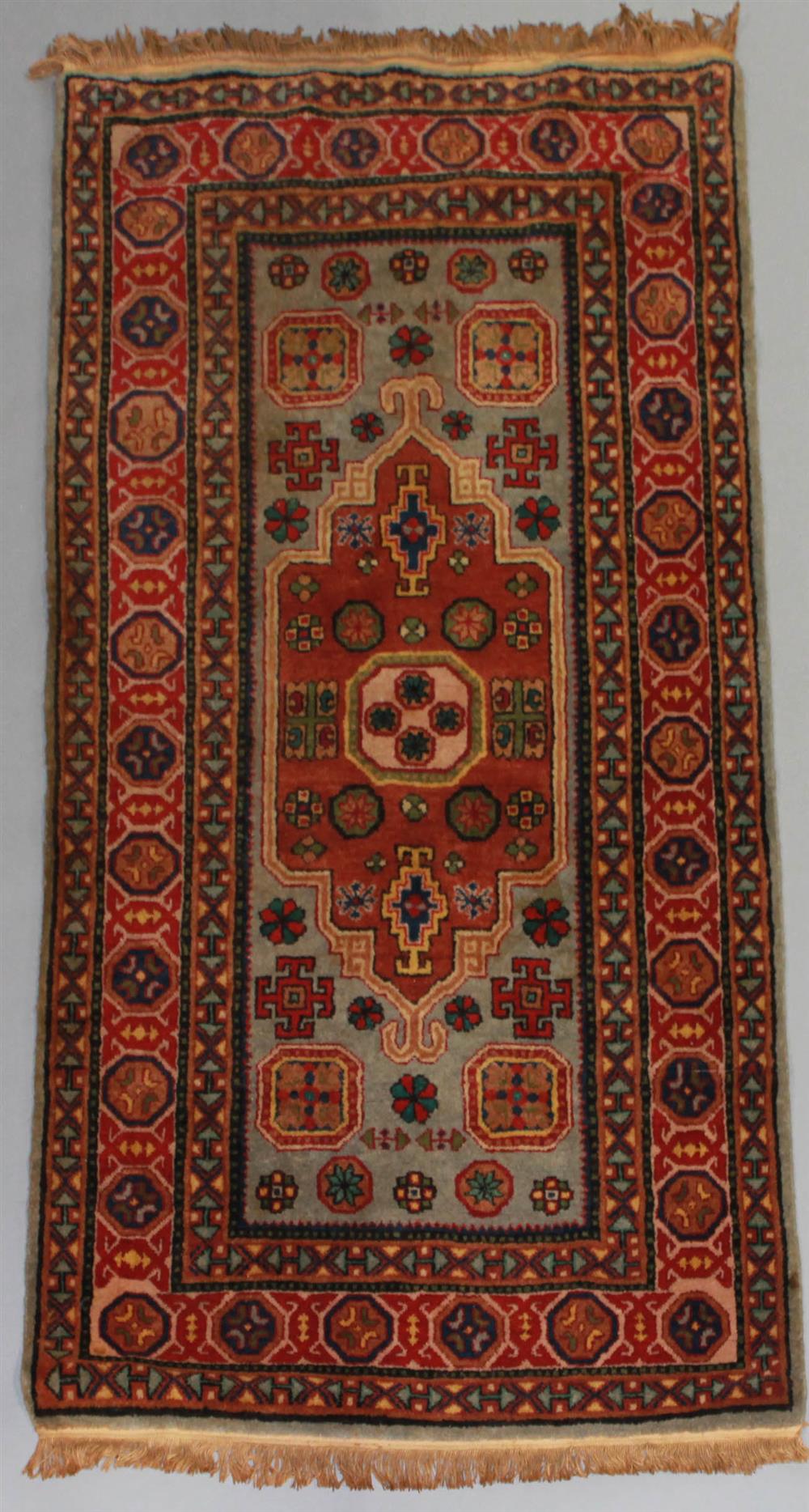 Appraisal: SAMARKAND UZBEKISTAN WOOL RUG having a typical narrow format with