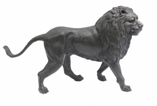 Appraisal: Patinated bronze lion sculpture unmarked walking with upraised head approx