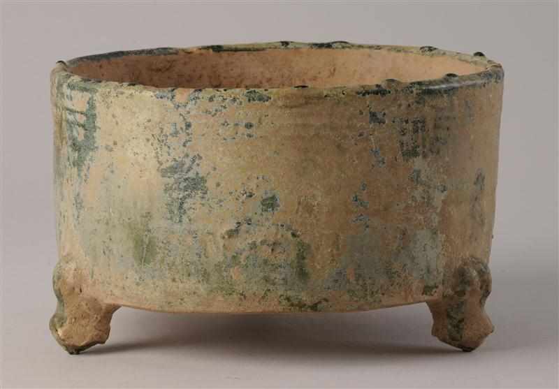 Appraisal: HAN GREEN-GLAZED POTTERY TRIPOD CENSER The cylindrical bowl with traces