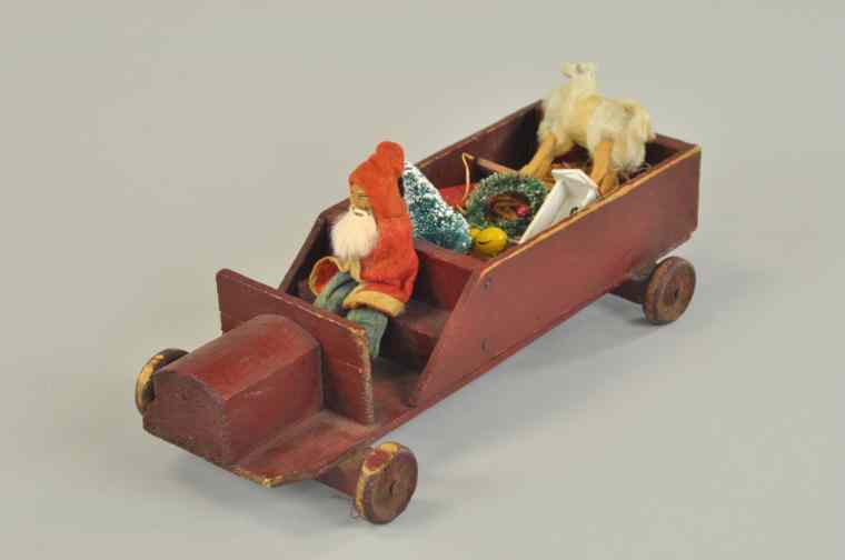 Appraisal: SANTA IN RED TRUCK DELIVERING TOYS Early composition Santa rabbit