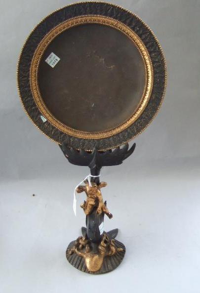 Appraisal: A Victorian bronze and gilt bronze table mirror the gilt