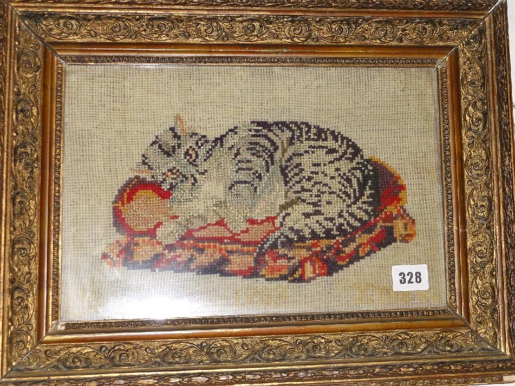 Appraisal: A th century needlepoint of a tabby cat on a