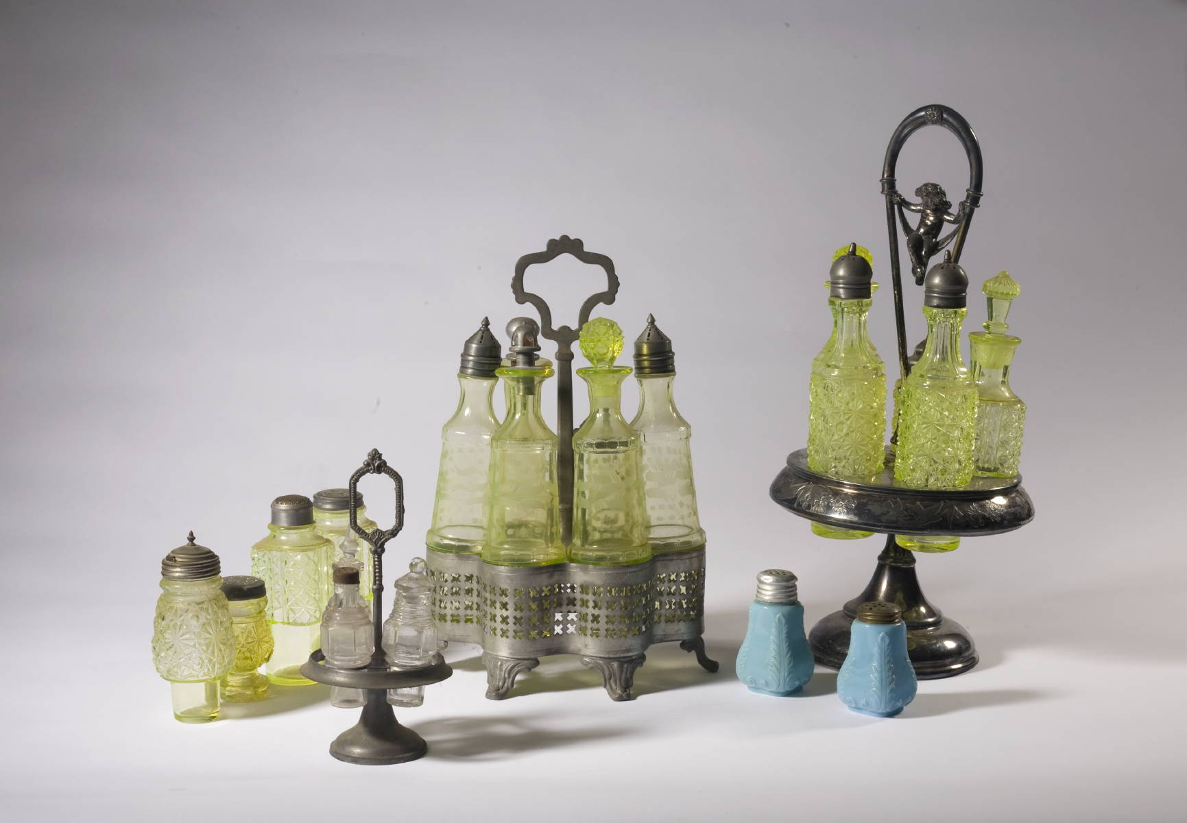 Appraisal: AMERICAN ASSEMBLED COLLECTION OF YELLOW GLASS CASTER BOTTLES AND FRAMES