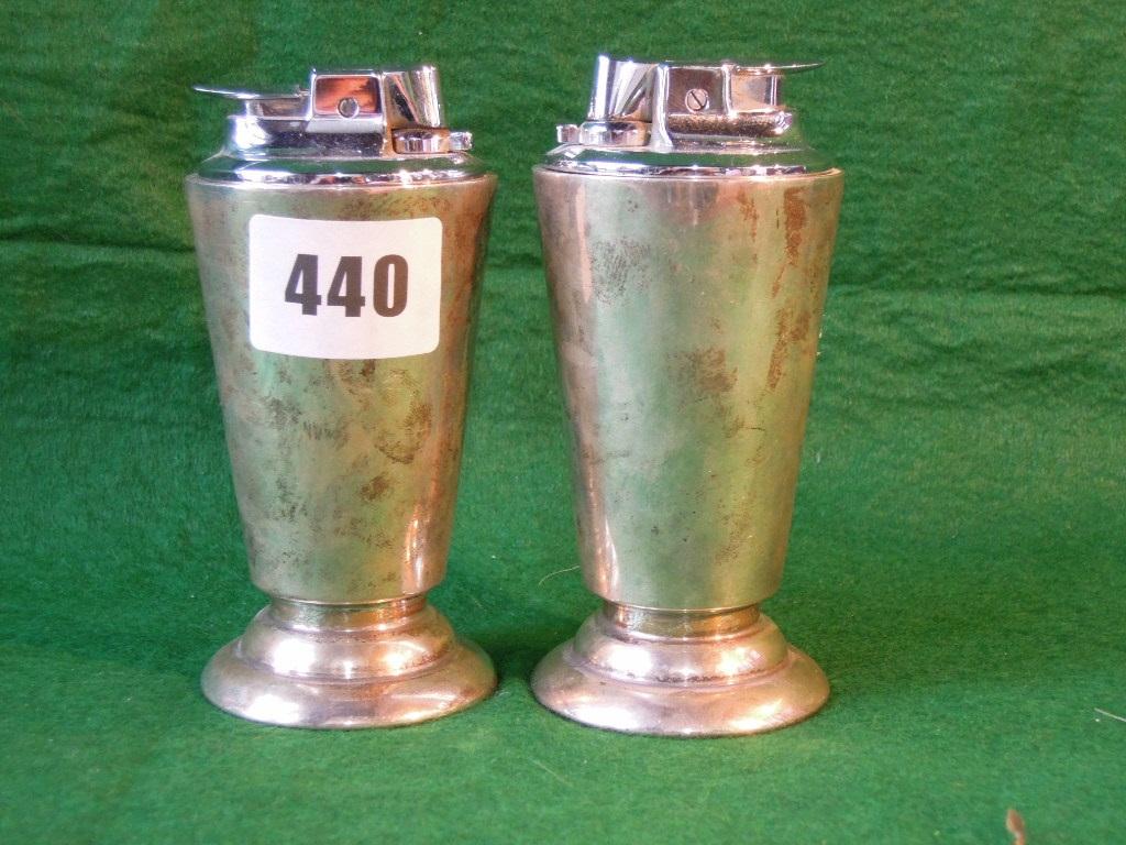 Appraisal: A pair of Art Deco style silver table cigarette lighters