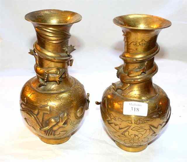 Appraisal: A PAIR OF CHINESE BRASS VASES with embossed decoration high