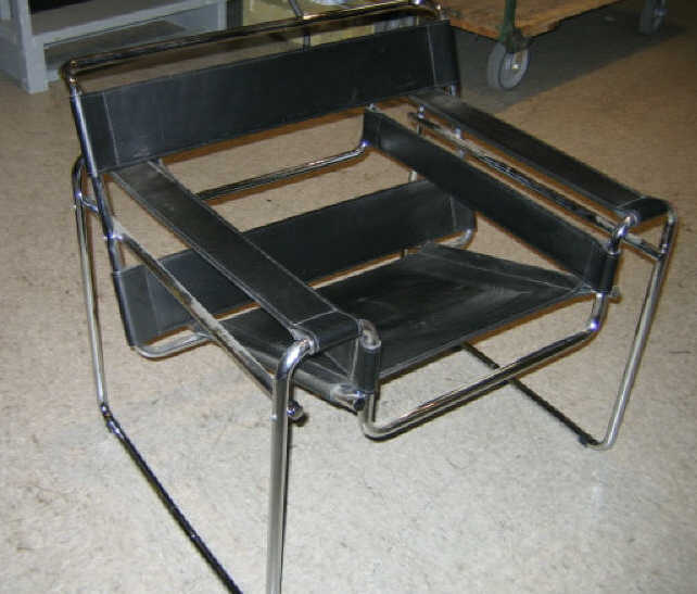 Appraisal: MARCEL BREUER Wassily armchair chromed tubular frame with black leather