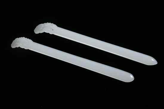 Appraisal: PAIR CHINESE WHITE JADE HAIR PINS Carved with ruyi-form finial