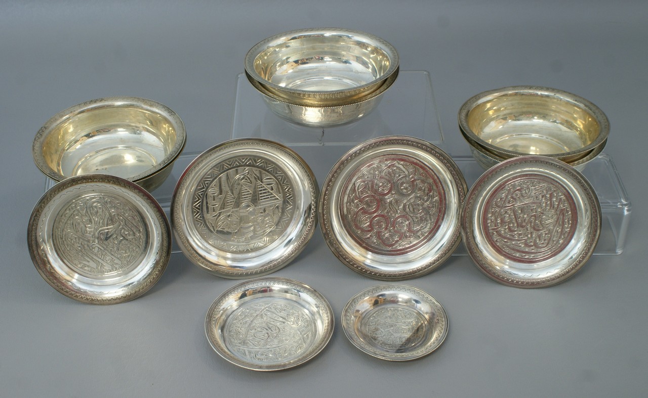 Appraisal: silver bowls and small plates with engraved and rolled Persian