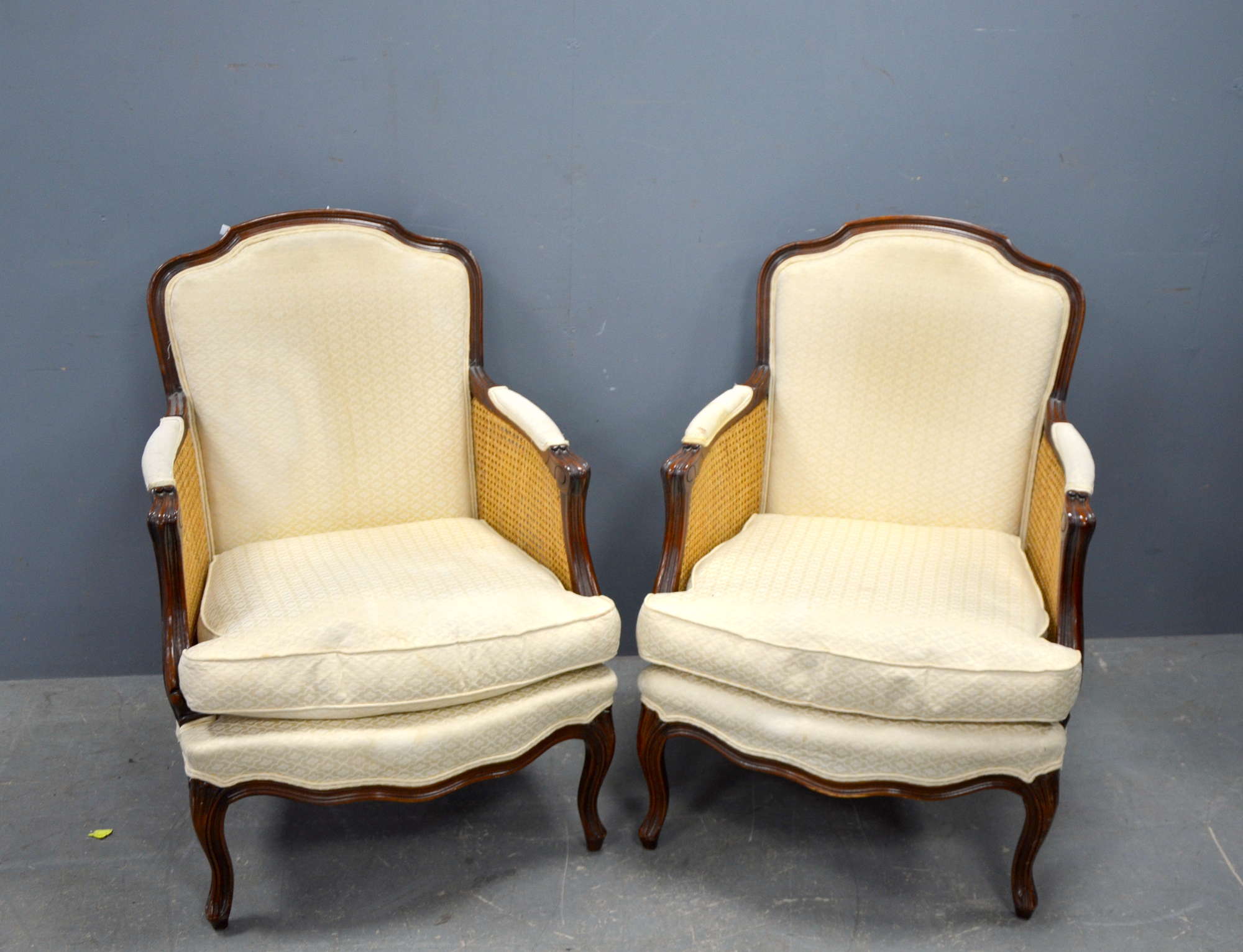 Appraisal: Pair of caned and upholstered bergeres