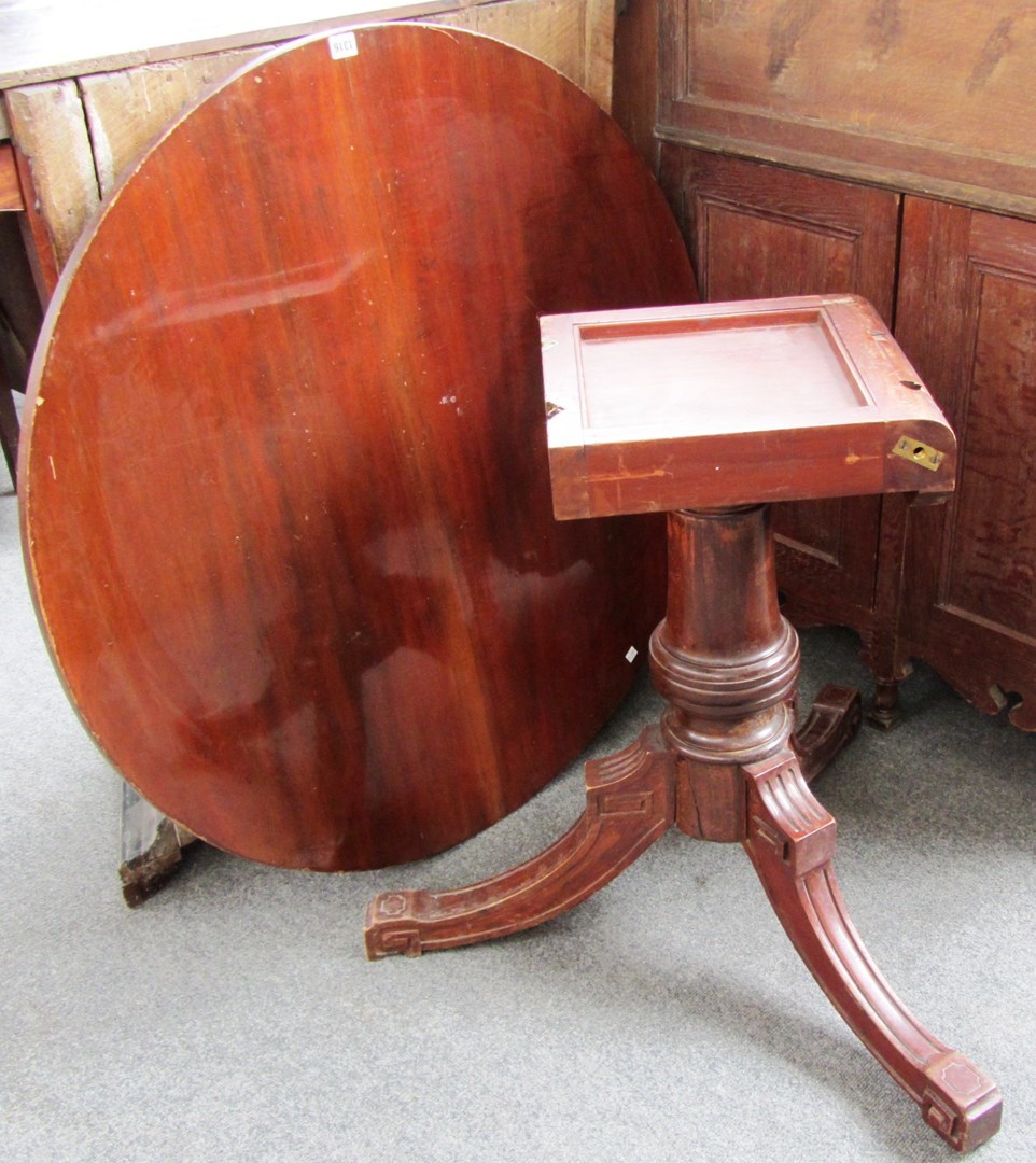 Appraisal: A th century mahogany centre table the circular snap top