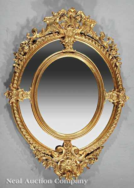 Appraisal: A Pair of Neoclassical-Style Carved and Gilded Mirrors pierced scrolled