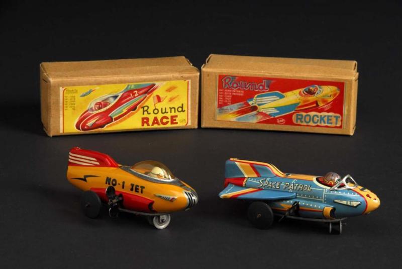 Appraisal: Lot of Tin Round Race Rocket Toys Description Japanese Wind-up