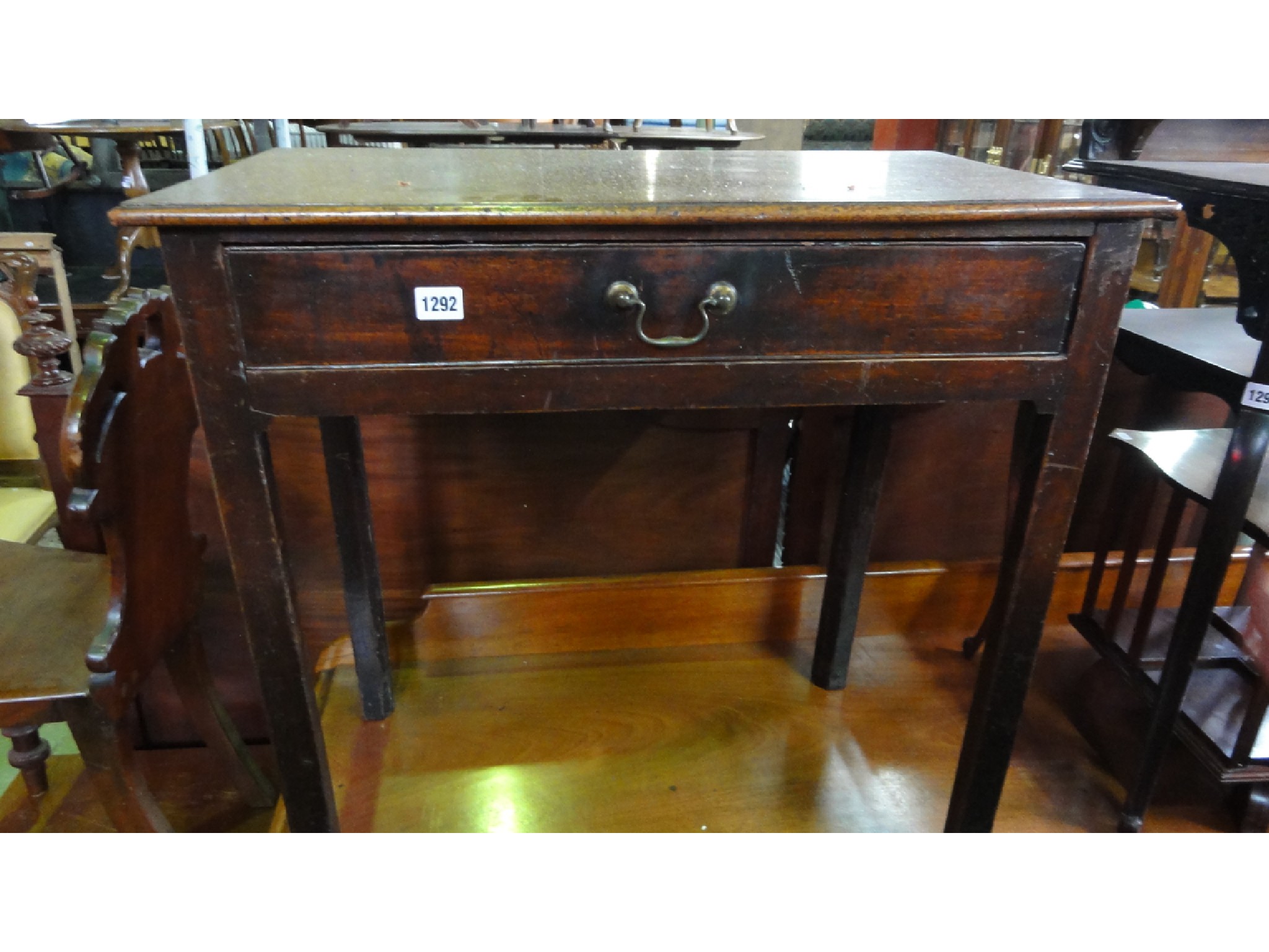 Appraisal: A Georgian mahogany side table with frieze drawer raised on