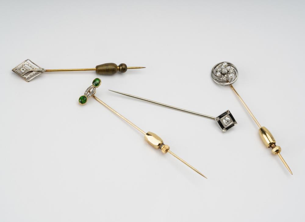 Appraisal: GROUP OF FOUR GEM-SET STICKPINScomprising one karat white gold stickpin