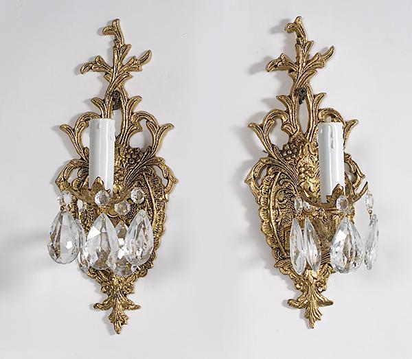 Appraisal: PAIR OF CRYSTAL AND BRASS SCONCES th century ornate sconces