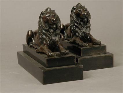 Appraisal: Pair of Patinated Metal Recumbent Lion Figures x x in