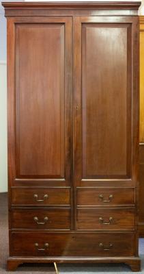 Appraisal: A George III style mahogany wardrobe the panel doors with