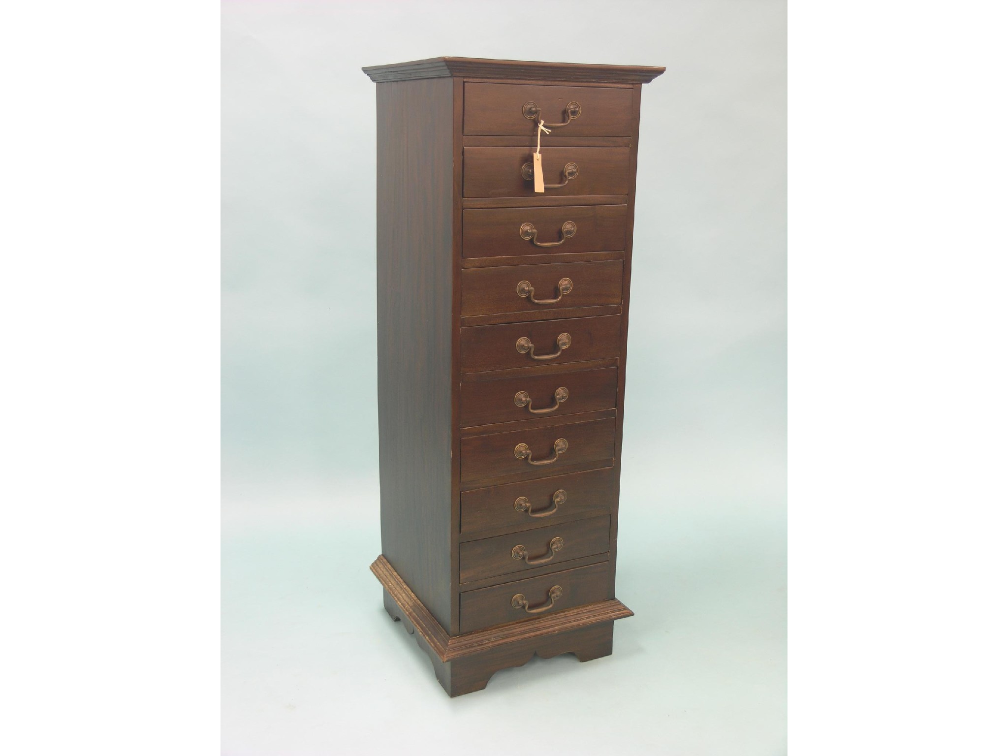 Appraisal: A tall mahogany filing chest ten drawers with brass swan-neck