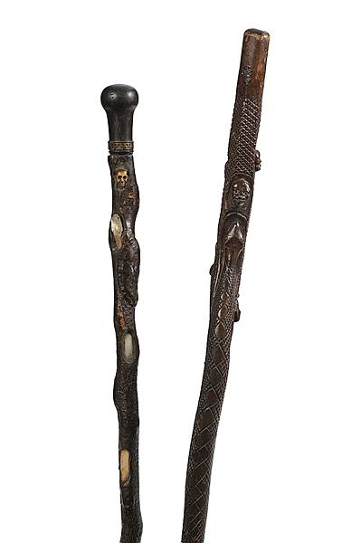 Appraisal: SKULL AND SERPENT MOTIF FOLK ART CANES Lot of two