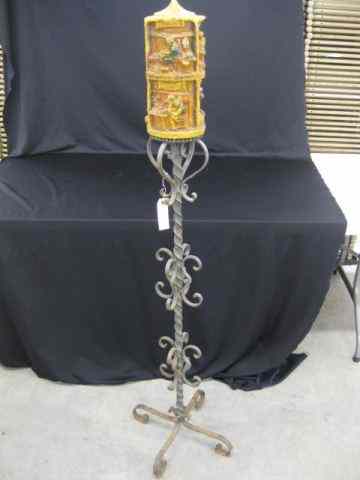 Appraisal: Wrought Iron Candlestand with Carved Candle scene of workers ''