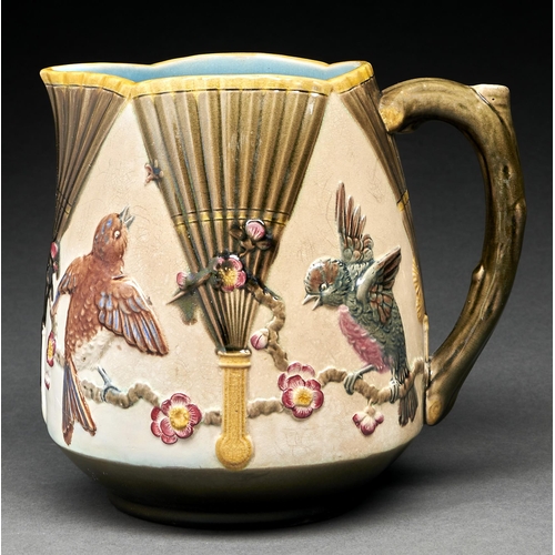 Appraisal: A Wedgwood majolica jug c moulded with birds on prunus