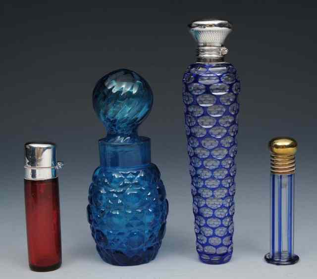 Appraisal: A VICTORIAN BLUE OVERLAID TAPERING GLASS SCENT BOTTLE with silver