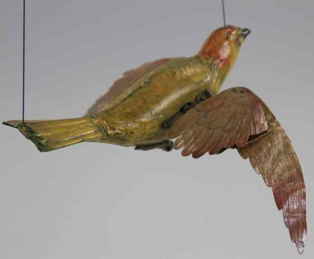 Appraisal: LEHMANN MECHANICAL FLYING BIRD Germany hand painted tin body done