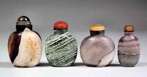 Appraisal: Four Chinese agate glass snuff bottles and stoppers one with