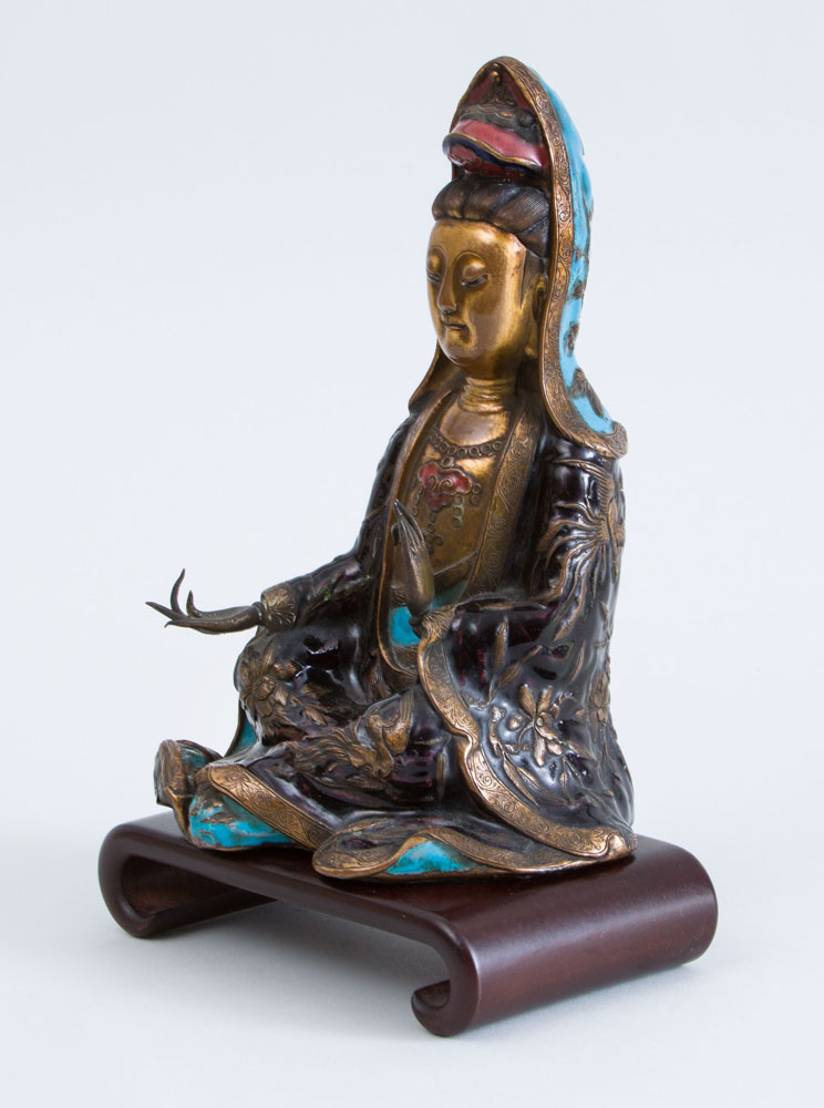 Appraisal: CHINESE ENAMEL-MOUNTED GILT-METAL FIGURE OF KWAN YIN On hardwood stand