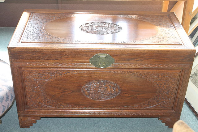 Appraisal: A HONG KONG CAMPHOR WOOD TRUNK with carved dragon and