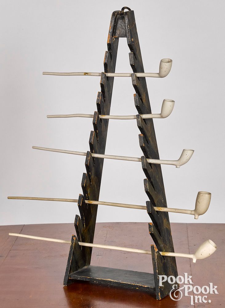 Appraisal: Painted pine pipe rack together with five pipes Painted pine